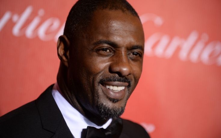 FILE - This Jan. 4, 2014 file photo shows actor Idris Elba at the Palm Springs International Film Festival Awards Gala  in Palm Springs, Calif. Elba tweeted Friday, April 18, that his son Winston was born Thursday, adding a photo of the babyís tiny hand gripping his finger. Elba had Winston with his girlfriend, Naiyana Garth. (Photo by Jordan Strauss/Invision/AP, File) ORG XMIT: NYET515