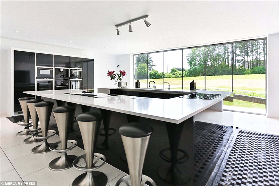 This modern kitchen would allow potential owners a breathtaking start to every morning, eating while gazing out onto the property's vast, lush gardens