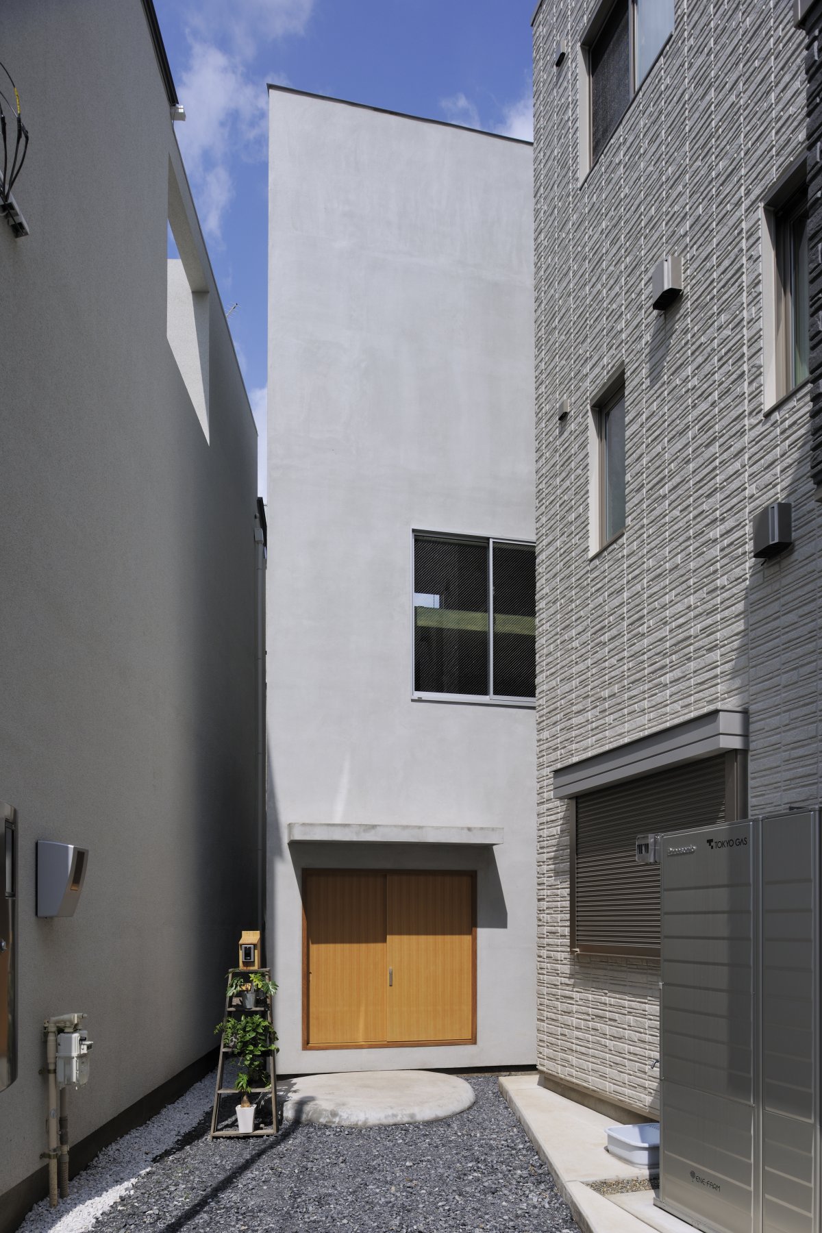 House T is tucked between two other townhomes in Tokyo. On the outside, it looks like a normal home.