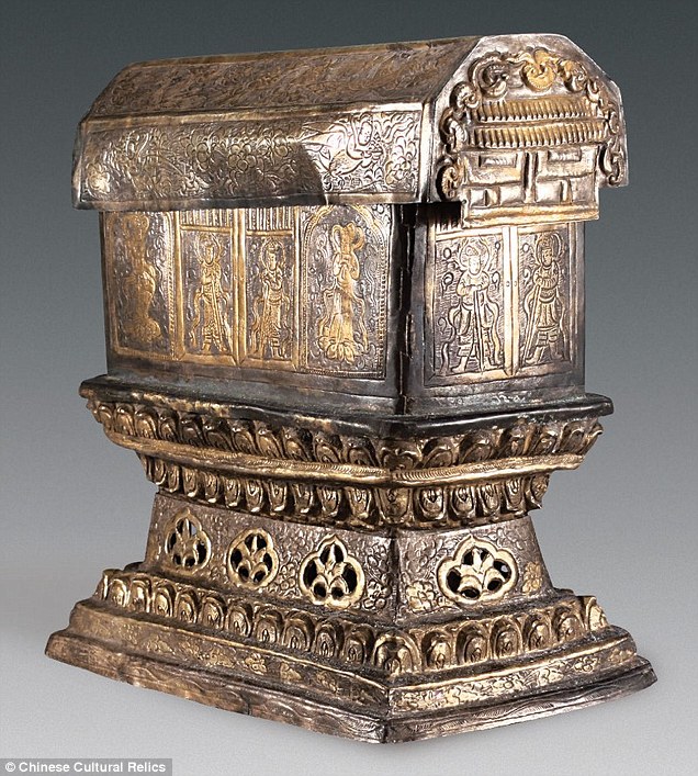 The gold chest containing the relics is held within a larger silver chest (pictured). Engraved in the gold and silver boxes are ornate images of lotus flowers, phoenixes and guardians of the box