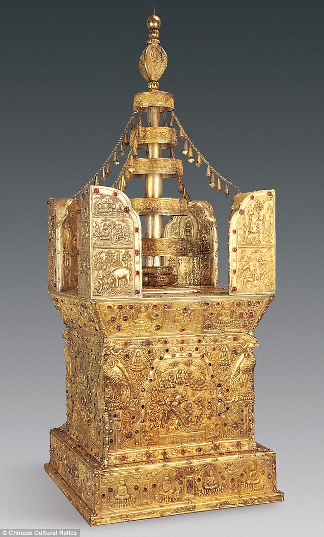 In a crypt underneath the Buddhist temple in Nanjing, locked safely in a stone chest, archaeologists found an ornate shrine called a stupa (pictured), used for meditation. The shrine is a box made from sandalwood, gold and silver with jewels embedded and contained the bone inside