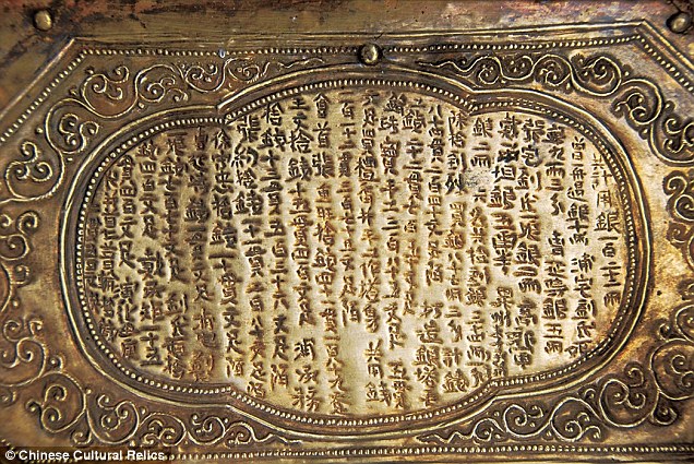 Inscriptions carved into the protective stone chest  as well as into the model shrine tell the story of how Buddha's skull bone came to lie in the tiny golden chest within