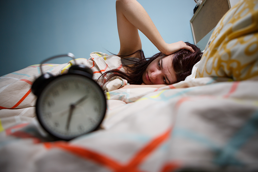 bigstock Woman with insomnia touching h 122225789