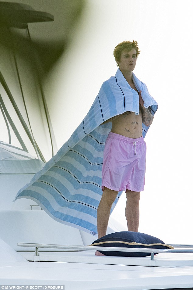 Real men wear pink! The Sorry singer looked like a hunk in a pair of pastel swim trunks