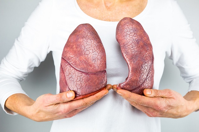 bigstock Woman showing two lungs in fro 86891879