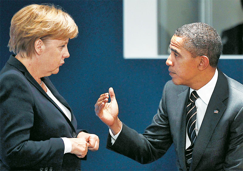 Συναντήση Μέρκελ- Ομπάμα πριν την σύσκεψη του ΝΑΤΟ (φωτό)