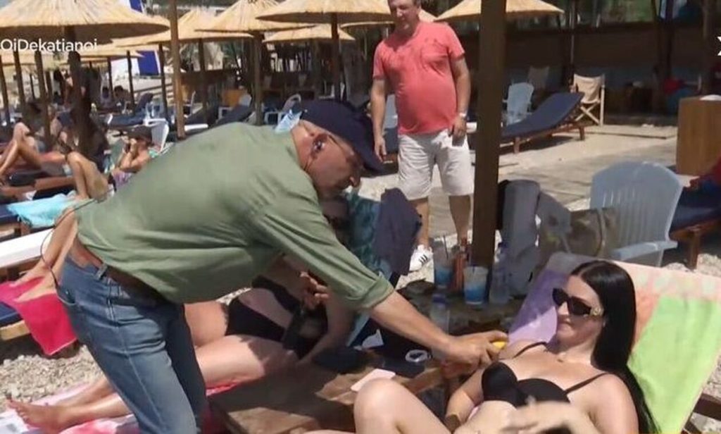 «Επικός» Γ.Τσελίκας: Βάζει λάδι στο στήθος λουόμενης στην παραλία (βίντεο)