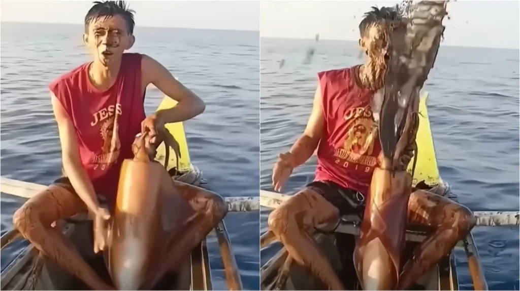 Φιλιππίνες: Η στιγμή που τεράστιο καλαμάρι «λούζει» ψαρά με μελάνι όταν το βγάζει από τη θάλασσα (βίντεο)