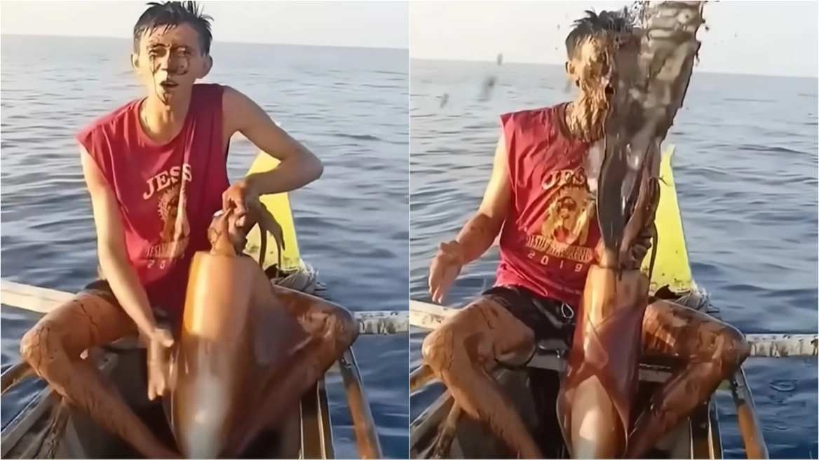 Φιλιππίνες: Η στιγμή που τεράστιο καλαμάρι «λούζει» ψαρά με μελάνι όταν το βγάζει από τη θάλασσα (βίντεο)